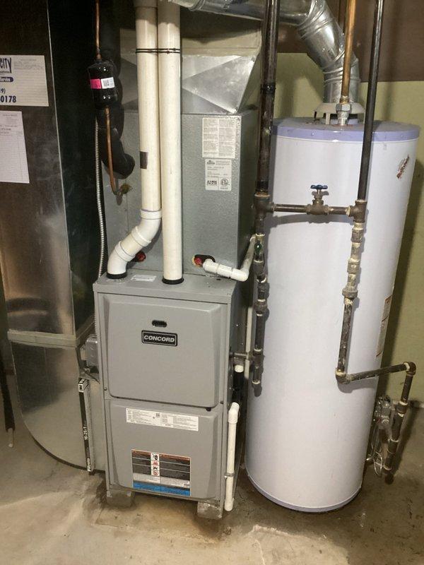 Conducted on-site assessment for complete air conditioning system replacement at residential property. Evaluated existing outdoor condenser unit and indoor furnace system to determine compatibility requirements and proper sizing for new AC installation. Documented current equipment configuration including Concord furnace with PVC venting system, existing ductwork connections, and outdoor condenser unit positioned on concrete pad with electrical disconnect. Provided comprehensive replacement estimate covering removal of existing AC system and installation of new energy-efficient air conditioning equipment with appropriate refrigerant lines, electrical connections, and integration with existing forced-air heating system.