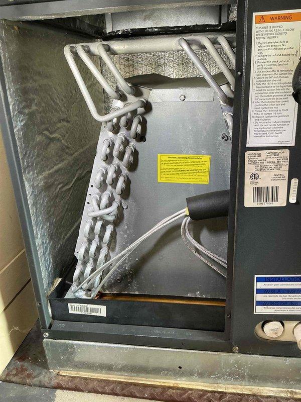 Completed preventive maintenance tune-up on 13-year-old residential air conditioning system. Performed standard inspection of heat exchanger coils, evaporator assembly, and air handler components; all internal components found to be in operational condition with normal wear for unit age.
