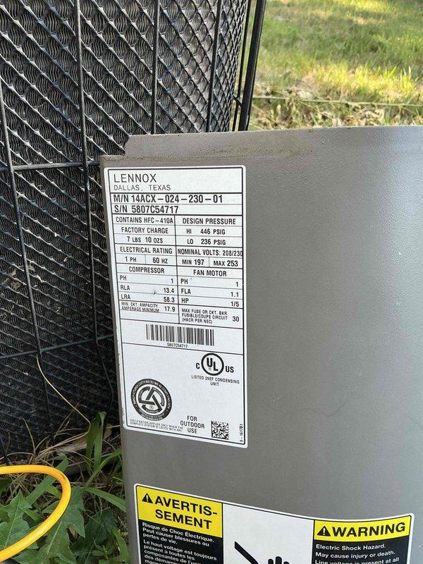 Responded to no cooling complaint on Lennox model WIN14ACX-024-230-01 unit containing R-410A refrigerant. Upon arrival, performed diagnostic assessment of outdoor condensing unit and associated electrical components including disconnect box and control systems. Unit specifications indicated 208-230V electrical service with 13.4 RLA compressor rating. Documented equipment condition and electrical connections at outdoor unit location and service disconnect panel for further evaluation and repair scheduling.