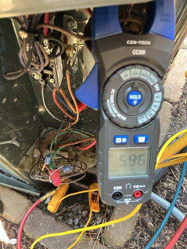# HVAC Maintenance Service Completed

Performed comprehensive preventive maintenance on a 12+ year old air conditioning system. Conducted electrical diagnostics using digital multimeter to verify proper voltage and amperage readings across system components. Tested capacitor functionality and measured electrical values at 6.86 (volts/amps) to ensure operation within manufacturer specifications. Inspected all electrical connections, wire terminals, and control wiring for secure connections and proper configuration. Verified DiversiTech disconnect switch operation and exterior electrical panel integrity. System tested and confirmed operational following maintenance procedures.