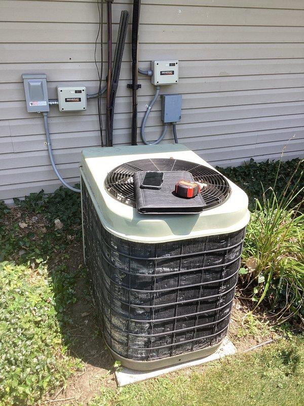 Completed comprehensive evaluation of existing HVAC system for full replacement estimate. Assessed outdoor Carrier condenser unit with cylindrical design and protective grille, noting current installation positioning adjacent to exterior wall with existing electrical infrastructure including dual meter panels and conduit routing. Evaluated indoor Carrier furnace system housed within utility closet enclosure, inspecting existing ductwork plenum, PVC condensate drainage configuration with proper trap installation, and flexible duct connections. Documented equipment specifications, spatial constraints, electrical service capacity, and installation accessibility to provide accurate replacement system recommendations and ensure proper sizing for residential comfort requirements.