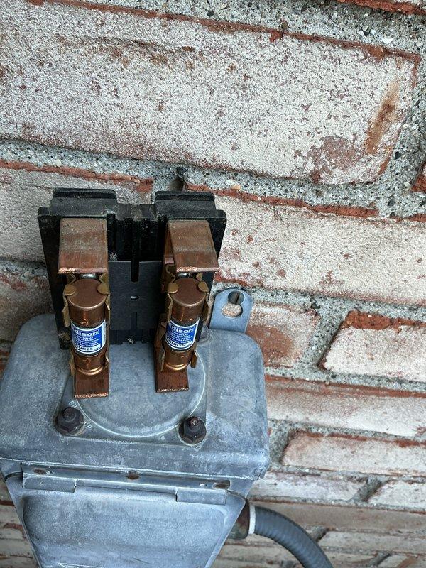 Completed preventative maintenance on 4-year-old residential air conditioning system. Inspected outdoor condenser unit, electrical disconnect with fuses, and verified proper clearances around equipment. All components operating within normal parameters with no immediate concerns noted.