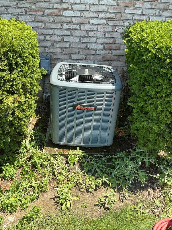 Completed preventative maintenance on 4-year-old residential air conditioning system. Inspected outdoor condenser unit, electrical disconnect with fuses, and verified proper clearances around equipment. All components operating within normal parameters with no immediate concerns noted.