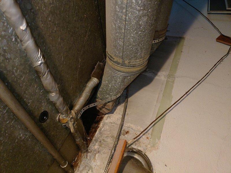 Performed comprehensive ductwork inspection and airflow assessment in response to inadequate circulation concerns during A/C operation. Inspected main supply trunk lines, branch ducts, and register connections throughout the system. Verified all supply vents were fully open and unobstructed, checked for proper damper positioning, and confirmed duct connections were sealed at junction points. Found ductwork structurally intact with metallic tape securing connections at transitions. System showing age-related dust accumulation but no significant air leakage or disconnected sections observed that would impact airflow performance.