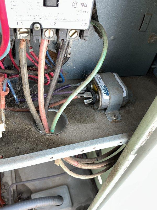 Performed preventative maintenance tune-up on rooftop air conditioning unit. Inspected electrical disconnect box, fuses, terminal connections, and blower motor assembly; cleaned accumulated dust and debris from electrical components and control panel. Unit operational upon completion of service.