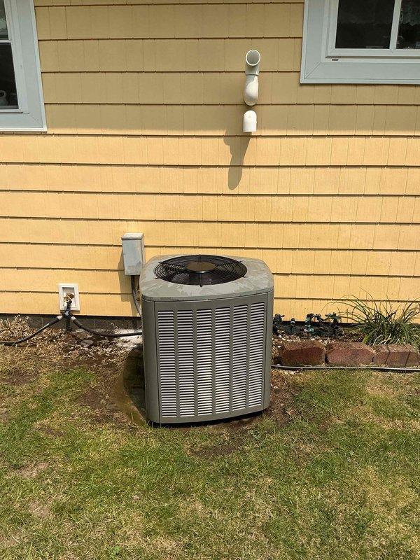 Responded to service call for non-operational air conditioning system and performed annual maintenance visit. Upon arrival, conducted comprehensive inspection of outdoor condenser unit and electrical components. Examined capacitor, contactor, and associated wiring within electrical panel, verifying all connections were secure and components functioning properly. Inspected condenser unit positioned on concrete pad, checking fan operation, refrigerant lines, and overall system performance. Restored air conditioning system to proper working order and completed routine annual furnace cleaning as requested, ensuring both heating and cooling systems are prepared for seasonal operation.