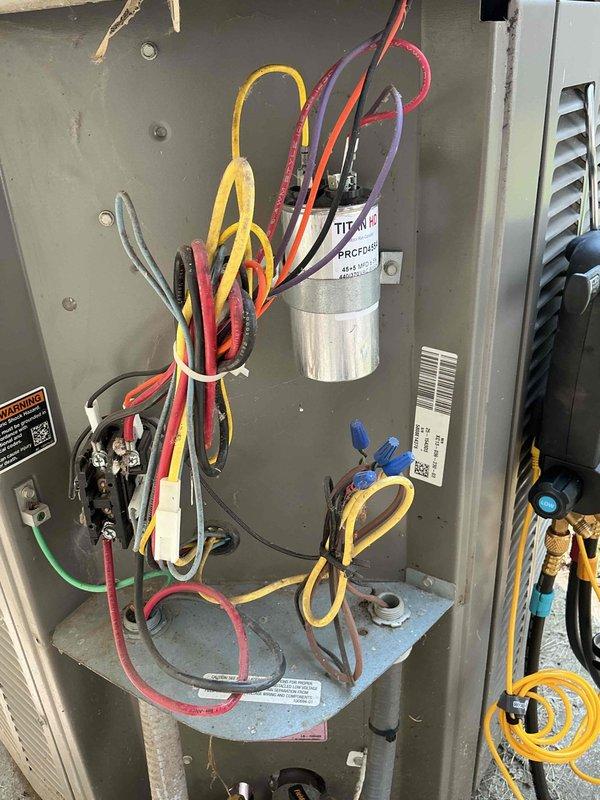 Responded to service call for non-operational air conditioning system and performed annual maintenance visit. Upon arrival, conducted comprehensive inspection of outdoor condenser unit and electrical components. Examined capacitor, contactor, and associated wiring within electrical panel, verifying all connections were secure and components functioning properly. Inspected condenser unit positioned on concrete pad, checking fan operation, refrigerant lines, and overall system performance. Restored air conditioning system to proper working order and completed routine annual furnace cleaning as requested, ensuring both heating and cooling systems are prepared for seasonal operation.