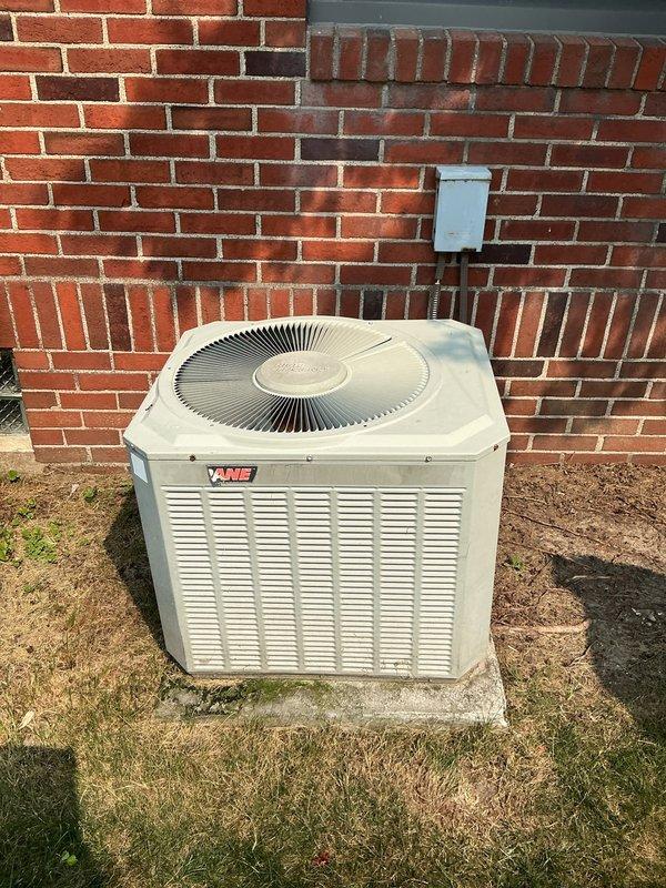 Responded to service call for air conditioning system assessment with no prior symptom information. Upon arrival, performed comprehensive diagnostic evaluation of VANE brand outdoor condensing unit and indoor air handler system. Conducted visual inspection of outdoor unit mounted on concrete pad, verified electrical disconnect functionality, and assessed overall system condition. Inspected indoor furnace and air handler components with panels removed to evaluate blower operation, refrigerant line connections, and electrical connections. Checked ductwork integrity and airflow pathways throughout system. System evaluated for proper operation and customer advised of findings.