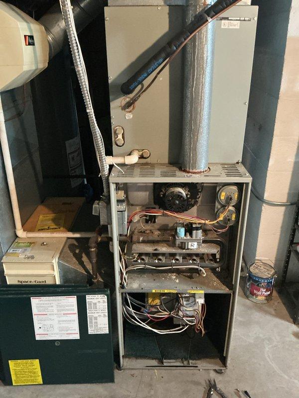 Responded to service call for air conditioning system assessment with no prior symptom information. Upon arrival, performed comprehensive diagnostic evaluation of VANE brand outdoor condensing unit and indoor air handler system. Conducted visual inspection of outdoor unit mounted on concrete pad, verified electrical disconnect functionality, and assessed overall system condition. Inspected indoor furnace and air handler components with panels removed to evaluate blower operation, refrigerant line connections, and electrical connections. Checked ductwork integrity and airflow pathways throughout system. System evaluated for proper operation and customer advised of findings.