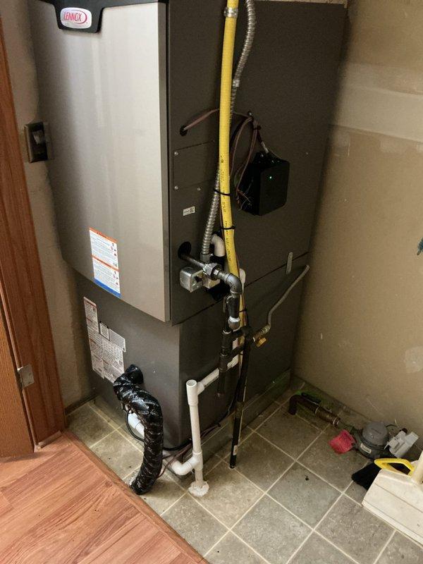 Completed full HVAC system replacement including installation of 96% efficiency downflow furnace with cased coil, single-stage condenser unit on new equipment pad, new refrigerant line set, disconnect box and whip, and programmable thermostat. All equipment leveled, tested, and verified operational with proper airflow and refrigerant charge.