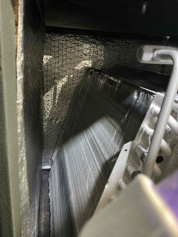 Completed preventive maintenance tune-up on 7-year-old outdoor A/C unit. Inspected evaporator coil, blower assembly, and electrical connections; noted moderate dust accumulation on blower wheel and interior surfaces consistent with normal operation. All components functioning within normal parameters upon completion of service.