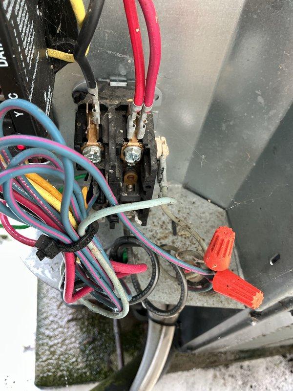 Completed preventative maintenance on 14-year-old residential air conditioning system located in backyard. Performed electrical diagnostics using clamp meter to verify proper amperage draw and system performance. Inspected capacitor, wiring connections, and terminal blocks for signs of wear or deterioration. All electrical connections were found secure with proper wire management in place. System operational and functioning within normal parameters at time of service completion.