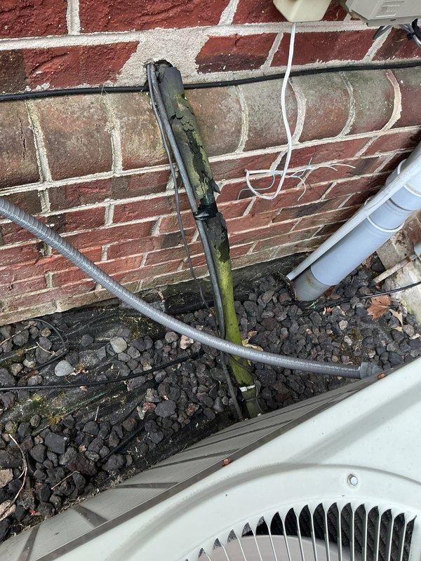 Responded to no cooling call on 35-year-old attic-mounted air conditioning system. Accessed attic unit via ladder and performed comprehensive diagnostic evaluation of the aging HVAC equipment. Upon inspection, determined system had reached end of serviceable life due to age and component deterioration. Documented existing outdoor condenser units and electrical connections showing typical wear patterns consistent with three-and-a-half decades of operation, including weathered conduit, aged junction boxes, and compromised insulation materials around equipment pad area.