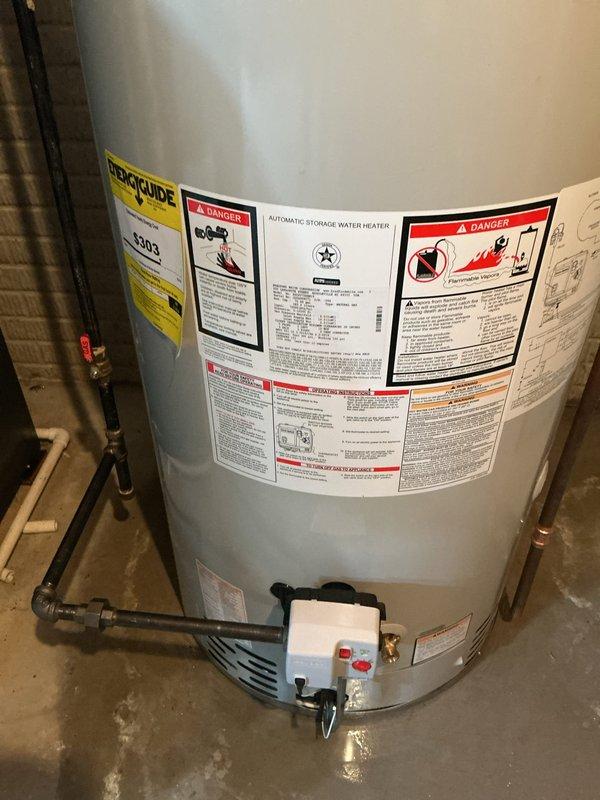 Installed a 75-gallon Bradford White residential water heater in basement utility area, connecting all necessary copper supply lines, electrical wiring, temperature and pressure relief valve, and gas connections. The unit was properly positioned against the concrete block wall with all piping, venting, and safety controls installed per manufacturer specifications and local plumbing codes.