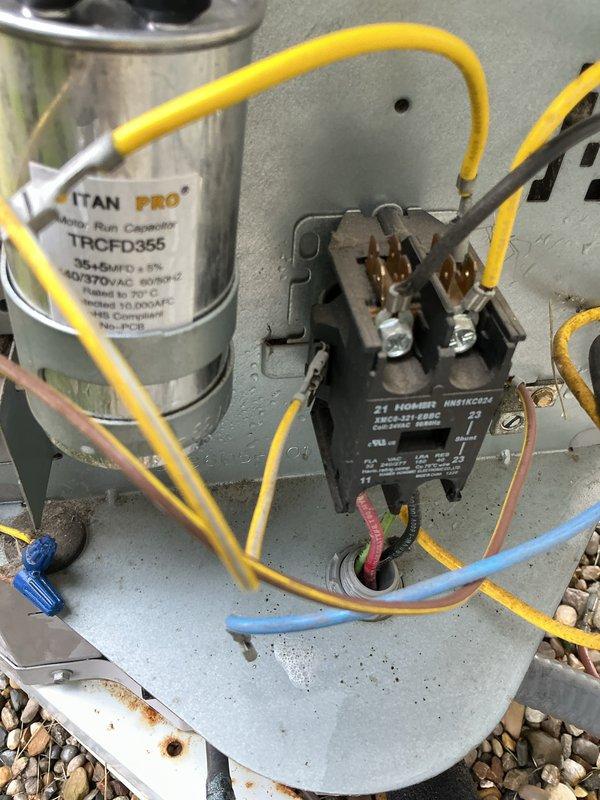 Completed annual maintenance on a 14-year-old air conditioning system. Performed comprehensive inspection of outdoor condensing unit, including verification of electrical connections at disconnect box and contactor assembly. Inspected TITAN PRO capacitor and ZT Hobson contactor for proper operation, confirmed all wire terminations were secure, and verified unit components were functioning within normal parameters.