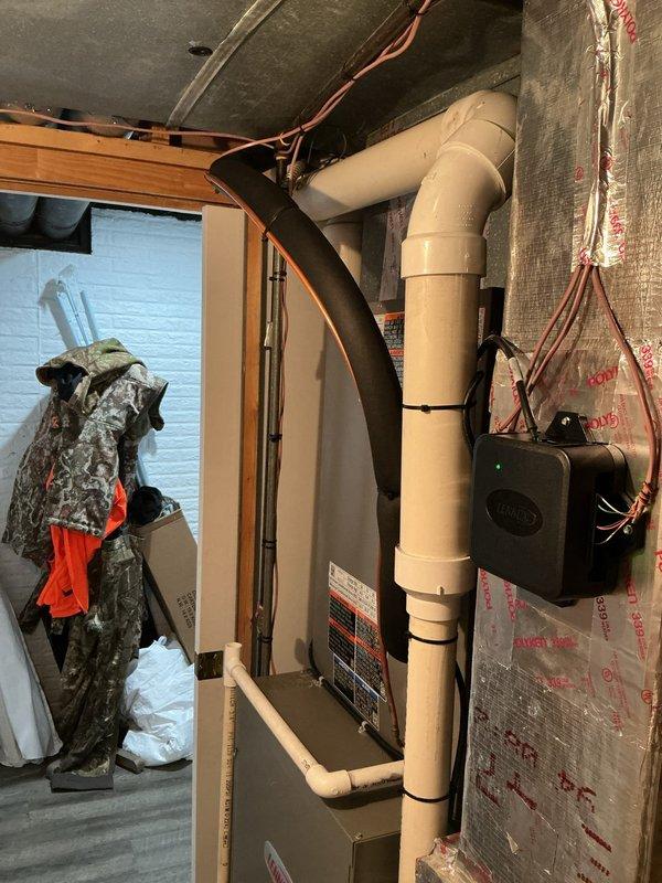 Completed full HVAC system installation including single-stage condenser unit with upflow cased evaporator coil. Installed new 7/8" x 30' refrigerant line set with proper insulation and routing through basement area. Upgraded electrical service with new dedicated 40-amp circuit using #8 wire run approximately 15 feet from main panel to disconnect, including new breaker installation to meet equipment specifications. Positioned condenser on new equipment pad with proper leveling and clearances. Installed WiFi-enabled programmable thermostat on main level with connection to new system. All installations completed per manufacturer specifications and local code requirements. System tested, charged, and operating within normal parameters.