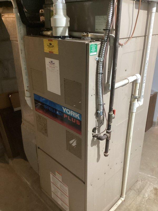 Conducted on-site evaluation of existing York Plus furnace system and current ductwork configuration in basement utility area. Assessed feasibility of relocating ductwork and replacing furnace unit to improve system efficiency and accommodate customer's layout requirements. Documented existing equipment specifications, refrigerant line routing, condensate drainage setup, and electrical connections. Evaluated structural considerations for potential duct relocation throughout residence, including measurements and access points along interior corridors. Provided comprehensive estimate for complete HVAC system replacement with recommendations for optimized ductwork placement based on current home configuration and heating/cooling load requirements.