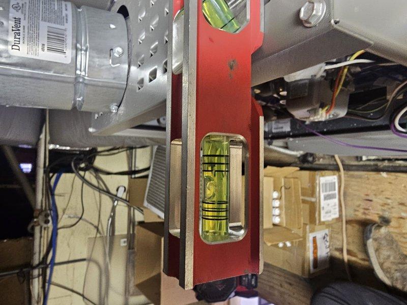 Installed an 80% efficiency, 70,000 BTU upflow furnace elevated on 8-inch support blocks with new sheet metal ductwork connections and programmed a new thermostat. Verified proper level and alignment of the unit during installation to ensure optimal performance and drainage. Completed all electrical connections and tested system operation to confirm heating functionality.
