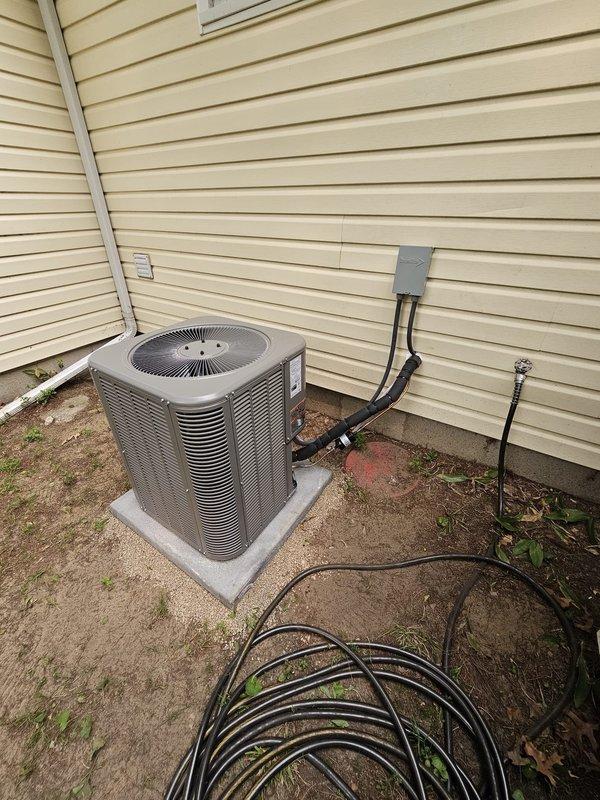 Completed full HVAC system installation including new Lennox single-stage air conditioning condenser unit, downflow cased evaporator coil, and all associated components. Installed new concrete equipment pad, ran new refrigerant lineset with proper insulation, mounted new electrical disconnect box and whip connection, and coordinated installation of dedicated electrical circuit to meet code requirements. System commissioned and tested successfully with 10-year parts and labor warranty coverage in effect.