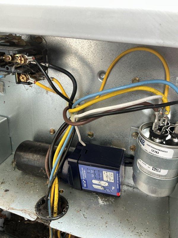 Responded to service call for air conditioning system cooling intermittently and failing to maintain thermostat temperature setpoint with "call for service" error message displayed. Upon inspection, diagnosed failed run capacitor causing compressor to short cycle and operate inefficiently. Replaced defective capacitor with new TITAN dual-run capacitor, verified proper electrical connections, and tested system operation. Unit now cooling properly with thermostat maintaining temperature setpoint and error message cleared.