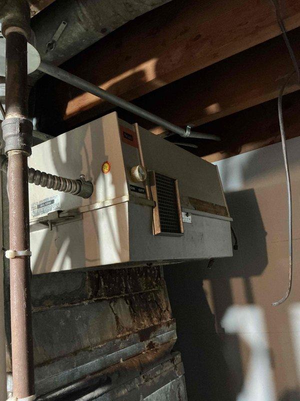Responded to report of condensation on floor near furnace. Upon inspection, found humidifier had been previously disconnected, leaving open water supply line that was causing moisture accumulation. Secured and capped the water line connection to prevent further leakage. Inspected furnace operation and condensate drain system to ensure proper function. Verified no additional moisture issues present and cleaned affected area around furnace base.
