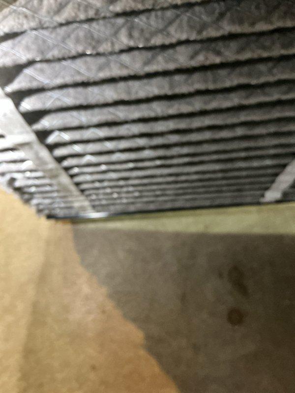 Performed seasonal tune-up on 12-year-old air conditioning system. Inspected outdoor condensing unit, examined evaporator coil fins for debris accumulation, and checked air filter condition. All components found operating within normal parameters with routine dust buildup noted on filtration media and coil surfaces.