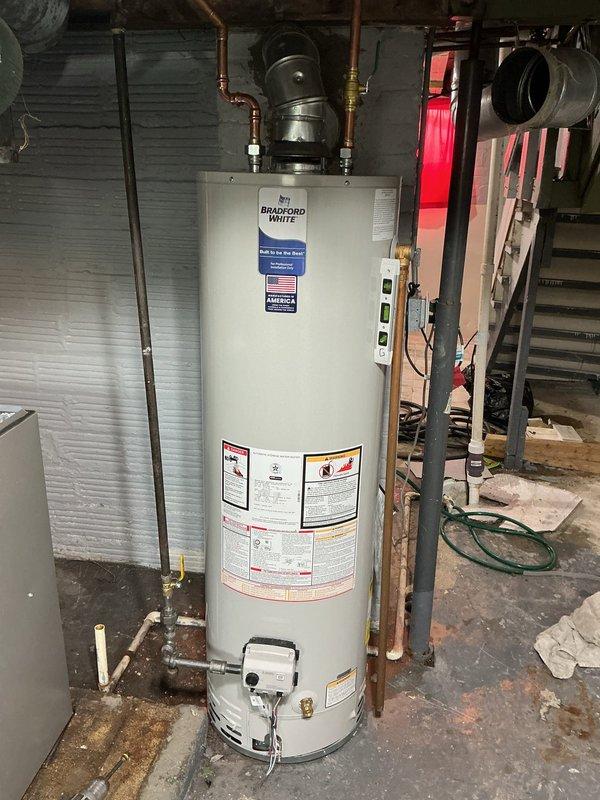 Completed full HVAC system installation including a 90% efficiency upflow furnace with B cabinet, 3-ton uncased evaporator coil, and 3-ton condenser unit relocated 2-3 feet left of window area and positioned on leveled ground pad. Installed 30-foot refrigerant lineset, 30/60 amp disconnect, 8-foot electrical whips, and new thermostat for complete system control. Additionally, replaced 40-gallon natural draft water heater with slim Bradford White unit featuring proper B-vent installation for safe exhaust venting. All equipment installed to manufacturer specifications with proper electrical connections, refrigerant charging, and combustion venting. System tested and operational upon completion.