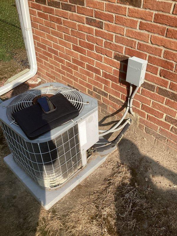 Conducted comprehensive on-site evaluation for complete HVAC system replacement involving existing Trane XE 90 furnace and outdoor air conditioning condenser unit. Assessed current equipment configuration, including indoor furnace installation with connected humidifier, ductwork connections, PVC venting system, and outdoor condensing unit mounted on concrete pad with electrical disconnect and refrigerant line routing. Documented existing system specifications, installation conditions, and spatial requirements to prepare detailed replacement estimate per previous coordination.