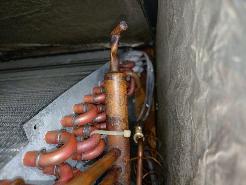 Performed comprehensive evaluation of existing furnace and air conditioning system for new homeowner. Inspected refrigerant lines, accumulator, copper piping connections, and evaporator coil assembly, documenting current condition of all components with no immediate deficiencies noted at time of inspection.