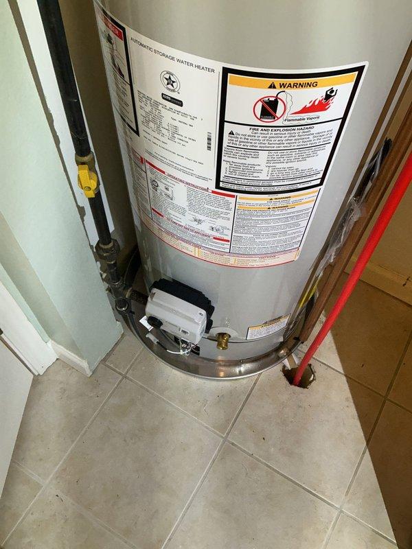 Responded to service call for non-operational 10-year-old Bradford White natural gas water heater. Performed diagnostic evaluation of unit and associated components including vent piping, copper supply lines, expansion tank, and safety valves. Assessed overall system condition, verified proper venting configuration with galvanized flue pipe, and inspected plumbing connections with brass fittings. Documented existing installation with expansion tank, multiple shut-off valves, and control box. Provided customer with assessment findings and replacement recommendations based on unit age and current operational status.