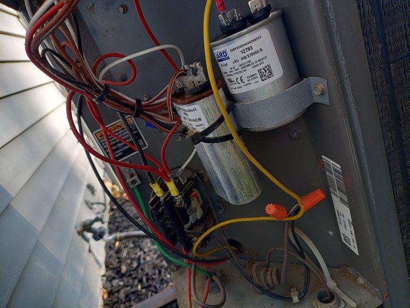 # No Cool Service Call - 20-Year-Old AC Unit

Responded to a no cooling complaint on a 20-year-old outdoor air conditioning system. Upon arrival, performed visual inspection of the condenser unit and accessed the electrical compartment to diagnose the issue. Examined the dual capacitor configuration, wiring connections, and control board for signs of failure or degradation. 

Given the age of the equipment and the nature of the failure, discussed repair versus replacement options with the property owner. The unit has exceeded its expected service life, and investing in major repairs may not be cost-effective. Documented the system condition with photographs showing the exterior unit positioning, electrical components, capacitors, wiring harness, and control board assembly. 

Provided recommendations for next steps based on the diagnostic findings and the advanced age of the equipment.