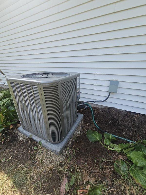 Completed callback to upgrade outdoor unit from single-stage ML-13 to two-stage ML-17KC1-036 condenser. Verified all refrigerant line connections, electrical conduit installation, and proper unit placement on concrete pad with secure mounting. System tested and operating within manufacturer specifications.