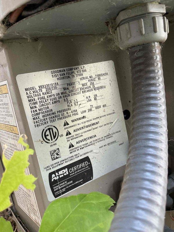 Completed MVP cooling maintenance on a 14-year-old Goodman split system at a vacant property. Serviced indoor air handler unit model VSX130181BA located in basement and outdoor condenser unit. Performed standard maintenance protocol including system inspection, cleaning, and operational testing. Both indoor and outdoor units showed age-appropriate wear with vegetation growth noted around outdoor condenser pad requiring clearance maintenance. System operating within normal parameters upon completion.