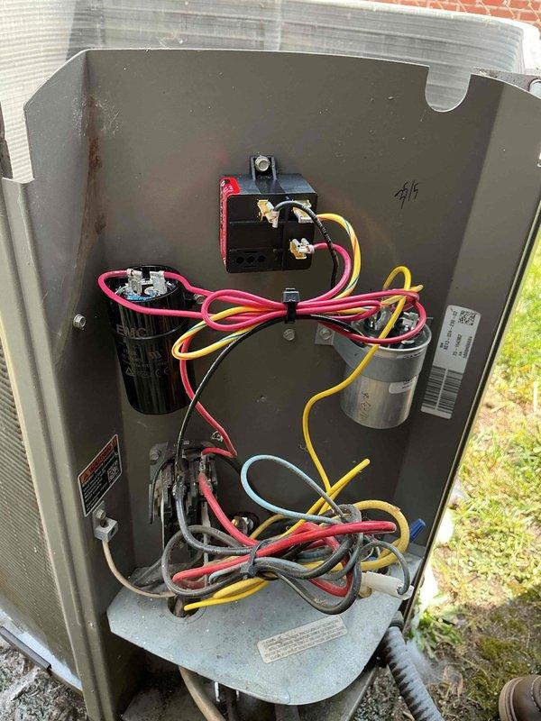 Performed routine cooling maintenance on an 18-year-old Lennox outdoor condensing unit. Inspected electrical components including contactor, dual capacitors, and associated wiring connections; verified proper operation of all internal components and confirmed unit functionality within normal parameters.