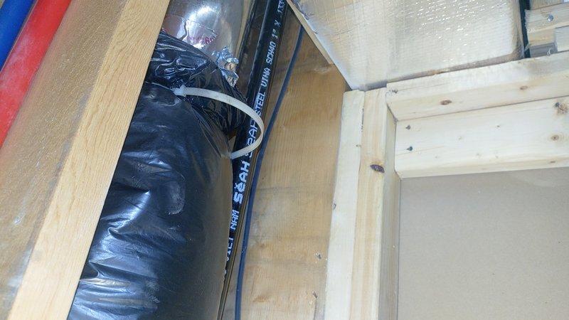 Responded to customer complaint of no airflow from single supply register while other vents functioned normally. Accessed crawlspace and attic areas to inspect ductwork routing and connections. Located black flexible duct run serving affected room and identified disconnected or crushed section preventing air delivery. Reconnected and secured flexible duct to supply trunk line with proper zip tie fastening, ensuring adequate airflow path restored. Verified all register connections intact and system operating correctly upon completion.