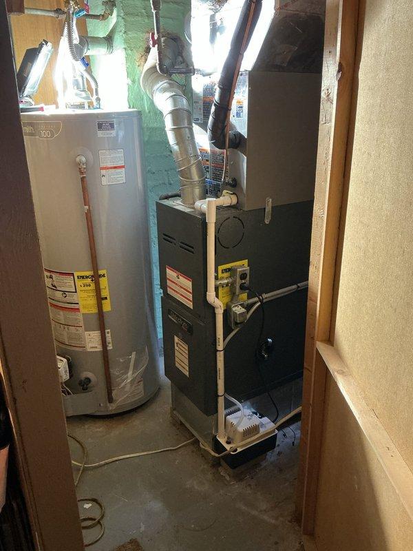 # HVAC System Installation

Completed full air conditioning system installation including new single-stage condenser unit with matching upflow cased evaporator coil. Relocated condenser unit 3 feet from electrical panel to ensure proper clearance and code compliance. Installed new concrete equipment pad, ran new refrigerant lineset with proper insulation, and installed new disconnect box with whip connection. Mounted new thermostat and verified all electrical connections. System tested for proper refrigerant charge, airflow, and temperature differential. All components operational and performing within manufacturer specifications.