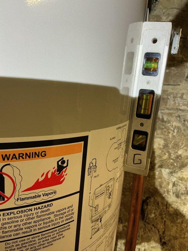 Completed installation of a 40-gallon power vent water heater in basement utility area. Removed existing unit and installed new water heater on stable base platform, connecting supply and discharge lines with flexible connectors and brass fittings to accommodate existing plumbing infrastructure. Verified level installation, proper venting configuration, and tested all connections for leaks prior to system activation.