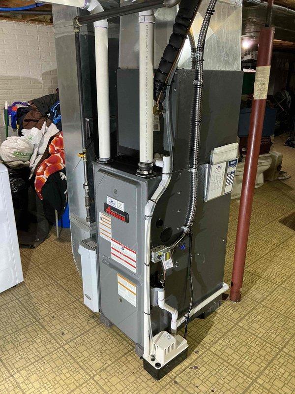Completed comprehensive tune-up service on 10-year-old furnace and air conditioning system. Performed visual inspection of ductwork using electronic camera inspection device to assess interior condition of flexible duct components, checked all mechanical connections, verified proper venting through PVC exhaust pipes, and ensured condensate drainage system functioning correctly. All equipment operating within manufacturer specifications with no immediate service concerns identified.