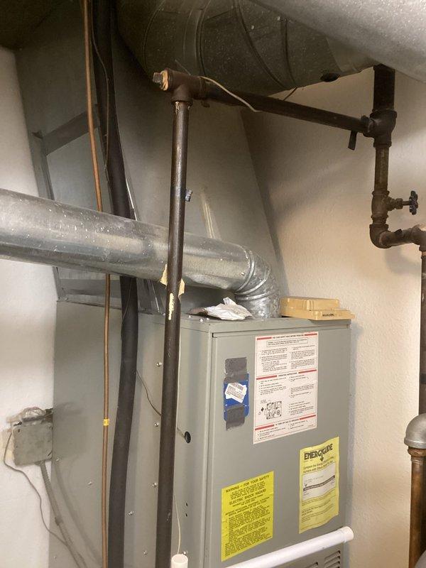 Completed comprehensive evaluation of existing HVAC system for full replacement estimate. Documented current Trane furnace/air handler unit and associated components including ductwork, electrical connections, copper refrigerant lines, condensate drainage system, and heat exchanger assembly. Photographed equipment specifications, manufacturer labels, and existing installation configuration to provide accurate replacement recommendations and ensure proper sizing for new system installation.