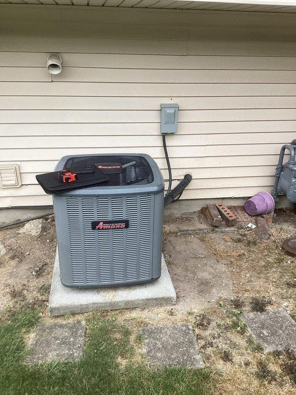 Conducted comprehensive assessment of existing residential HVAC system for complete air conditioning replacement. Evaluated current Amana condenser unit located on exterior concrete pad, noting operational status and existing electrical connections via weatherproof disconnect box. Inspected indoor equipment including furnace, air handler, and Space-Gard air filtration system in basement mechanical room. Documented refrigerant line routing, PVC condensate drainage, electrical service, and overall system configuration. Performed equipment measurements and specifications review to prepare replacement estimate for new air conditioning system compatible with existing furnace and ductwork infrastructure.