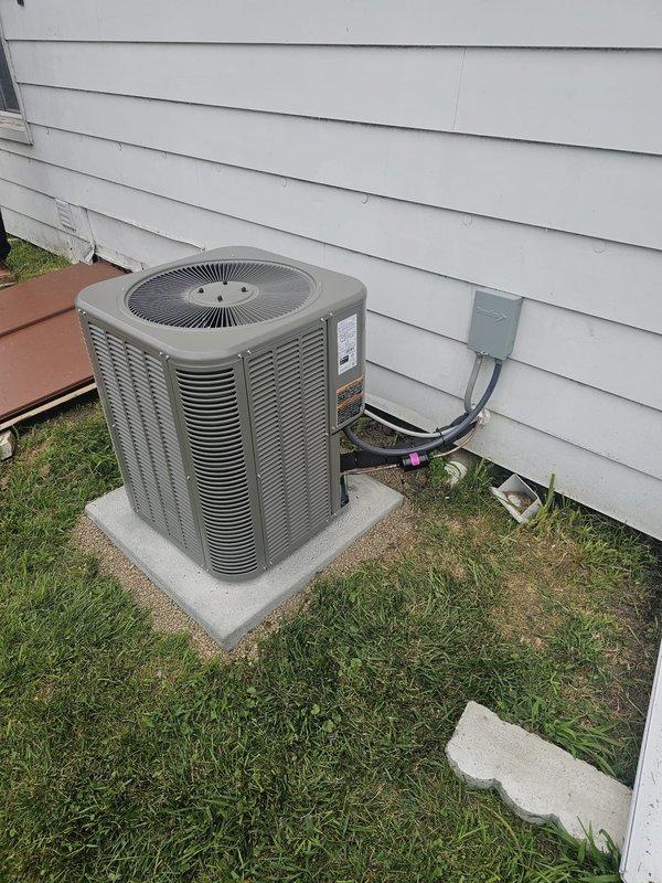 Completed full HVAC system installation in half basement/crawl space configuration. Installed horizontal slab coil to replace existing CSCF1824N6DA coil. Ran new 3/4" x 30' refrigerant line set from indoor coil to outdoor unit. Positioned single-stage air conditioning condenser on new concrete pad with proper clearances from structure. Installed new electrical disconnect box and whip for outdoor unit power supply, ensuring code-compliant wiring and connections. Mounted and programmed new thermostat for system control. Verified all refrigerant connections, tested electrical components, and confirmed proper system operation upon startup.