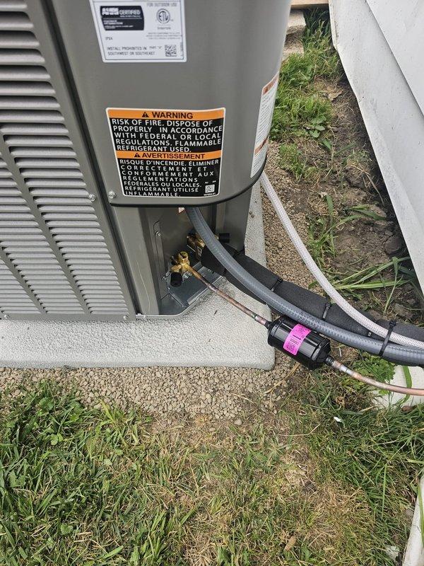 Completed full HVAC system installation in half basement/crawl space configuration. Installed horizontal slab coil to replace existing CSCF1824N6DA coil. Ran new 3/4" x 30' refrigerant line set from indoor coil to outdoor unit. Positioned single-stage air conditioning condenser on new concrete pad with proper clearances from structure. Installed new electrical disconnect box and whip for outdoor unit power supply, ensuring code-compliant wiring and connections. Mounted and programmed new thermostat for system control. Verified all refrigerant connections, tested electrical components, and confirmed proper system operation upon startup.