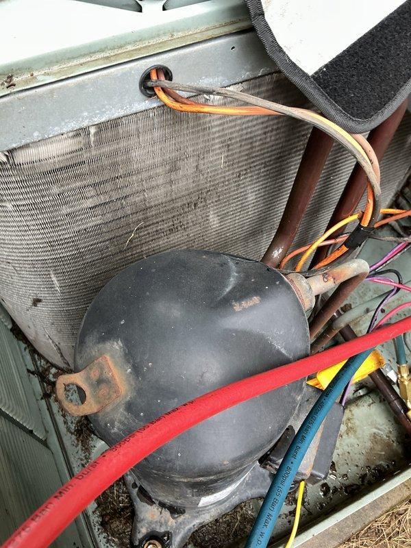 Completed preventative maintenance tune-up on 2-year-old air conditioning system. Performed comprehensive inspection of compressor, condenser coil, capacitor, refrigerant lines, and electrical connections. All components found operating within normal parameters with routine dust accumulation typical for unit age.