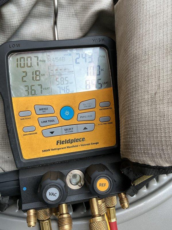 Performed routine maintenance tune-up on a one-year-old HVAC system. Connected refrigerant manifold gauge set to measure system pressures and temperatures, verifying proper refrigerant charge and operating parameters. All readings indicated the unit is functioning within manufacturer specifications.