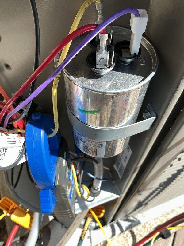 Responded to callback for unusual noises in ductwork and loud operational sounds from system installed in April 2024. Performed diagnostic inspection of outdoor unit, checking refrigerant service ports, electrical connections, and capacitor assembly. System found to be operating within normal parameters with proper refrigerant charge (R454B) and all electrical components functioning correctly. Verified capacitor connections secure and all wire terminations tight. No mechanical defects or loose components identified that would cause reported noise concerns. Recommended monitoring system operation and potential ductwork inspection to identify source of acoustic transmission.