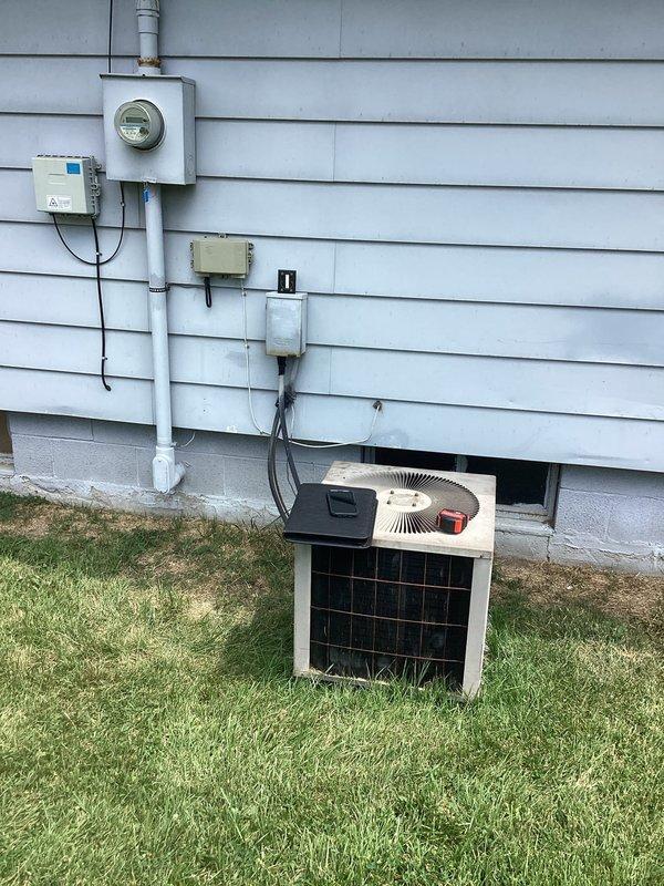 Conducted comprehensive site evaluation for complete air conditioning system replacement at residential property. Assessed existing HVAC infrastructure including basement-mounted furnace with connected ductwork and exterior condenser unit with electrical connections. Documented current system configuration, electrical service components including meter base and disconnect switch, and existing ductwork layout to provide accurate replacement specifications and equipment recommendations for new AC installation.