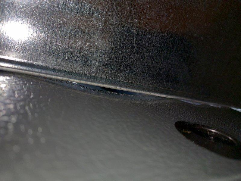 Responded to customer report of loud noise during furnace operation following recent installation. Upon inspection, discovered significant condensation accumulation on ductwork and air handler surfaces in attic space, indicating excessive moisture buildup due to inadequate insulation or air sealing. Documented moisture conditions on sheet metal ductwork and interior air handler components with photographic evidence. Identified condensation issue as likely source of reported operational noise. Advised customer of findings and recommended corrective measures to address humidity infiltration and prevent future condensation-related problems.