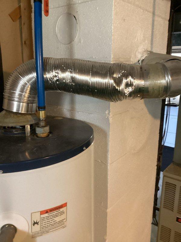 Conducted comprehensive HVAC system evaluation for residential property requiring replacement estimate. Documented existing equipment including water heater with flexible aluminum vent ducting and associated plumbing connections featuring PEX and copper piping in unfinished utility space. Photographed current installations and configuration to provide detailed assessment for complete system replacement specifications.