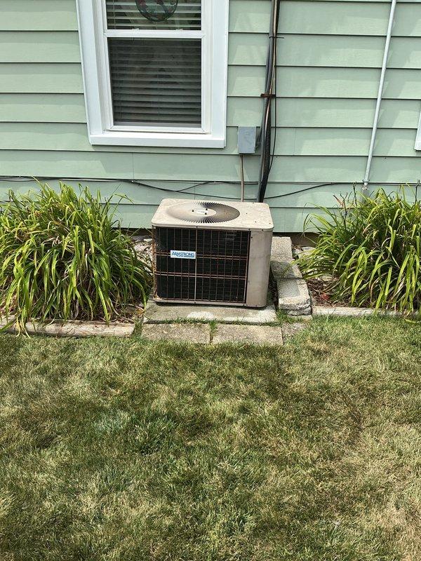 Completed routine cooling maintenance on 16-year-old residential air conditioning system. Performed standard inspection of outdoor condensing unit and indoor air distribution components, verified proper operation of all equipment, and documented system condition with photographic records.