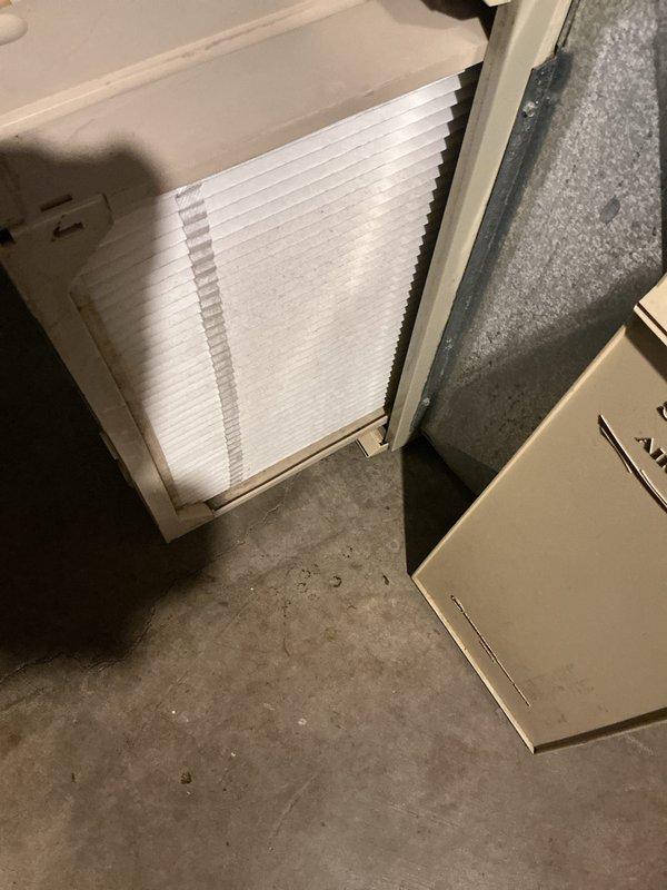 Completed annual maintenance on 12-year-old air conditioning system. Removed and cleaned condenser coil which showed significant dirt and debris accumulation on exterior fins, inspected electrical connections and fan assembly operation, and replaced indoor air filter which displayed dust buildup. All components tested and system returned to normal operation.